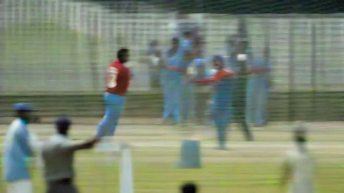 Indian cricketer celebrating a century on the pitch during a T20 international match.