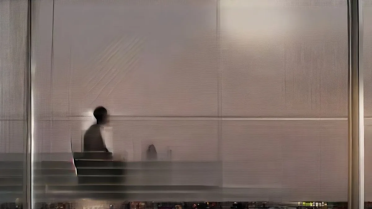 Financial analyst reviewing investment documents in a modern office