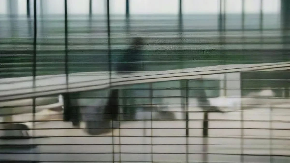 Financial professionals in a corporate boardroom reviewing documents overlooking a high-rise city skyline.