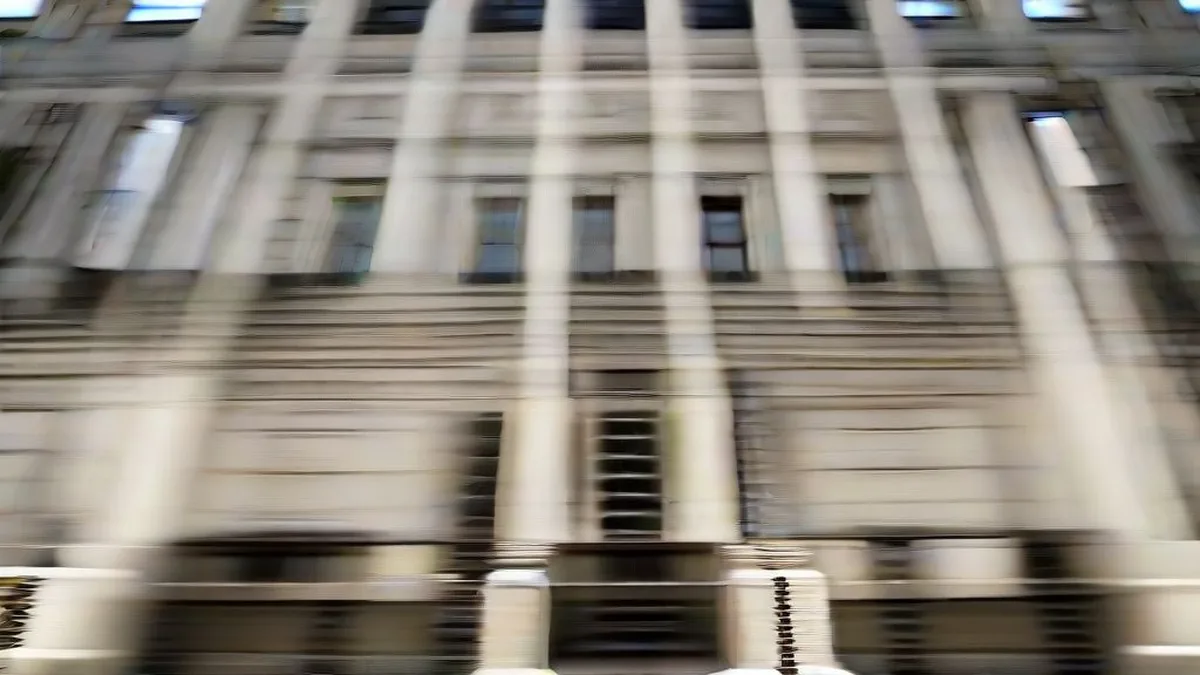 Exterior architectural view of a classical government capitol building under natural overcast daylight