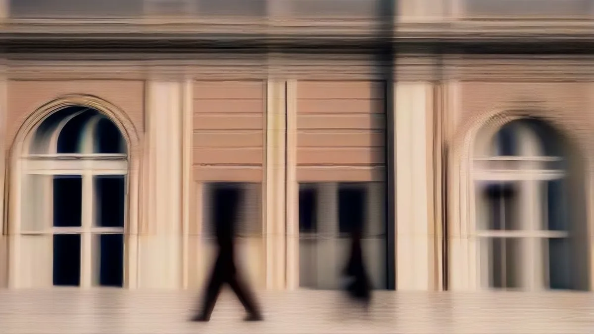 Corridor of the Allahabad High Court with legal practitioners walking between courtrooms