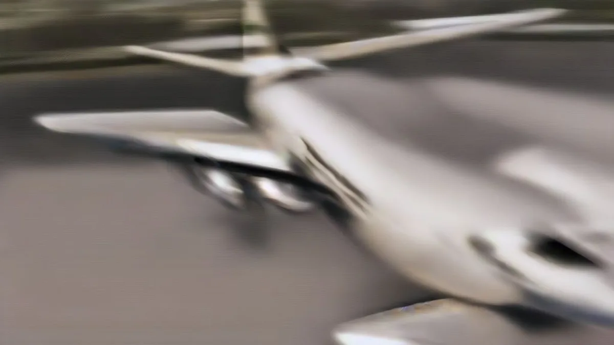 Executive jet on an airport tarmac at dusk with government sedans and security detail.