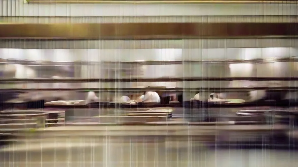 Busy casual dining restaurant interior during evening service with patrons and servers