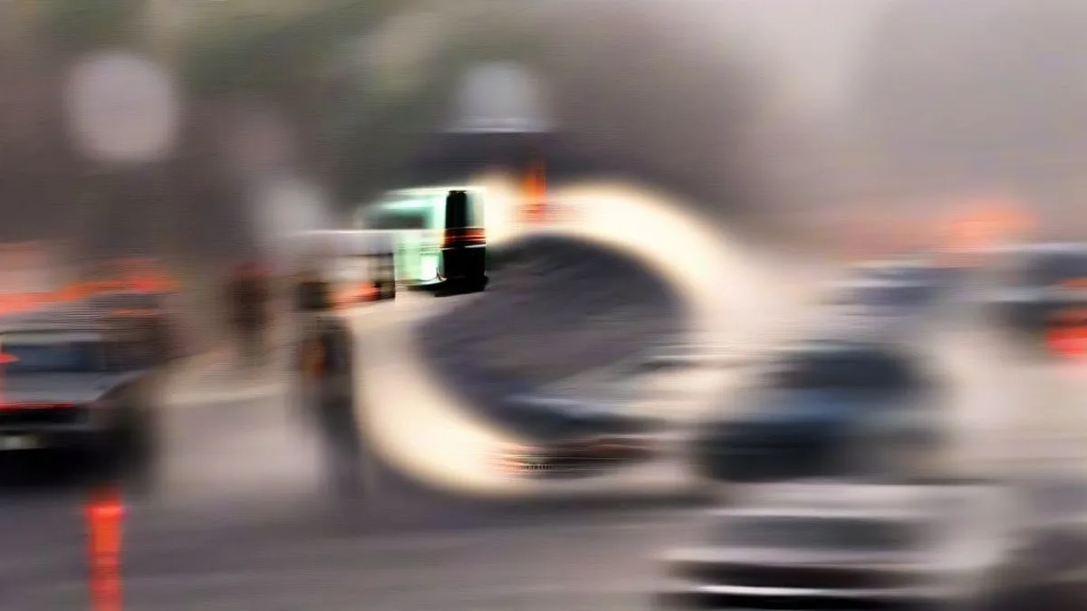 Traffic police inspecting vehicles at a highway checkpoint during early morning smog in Delhi