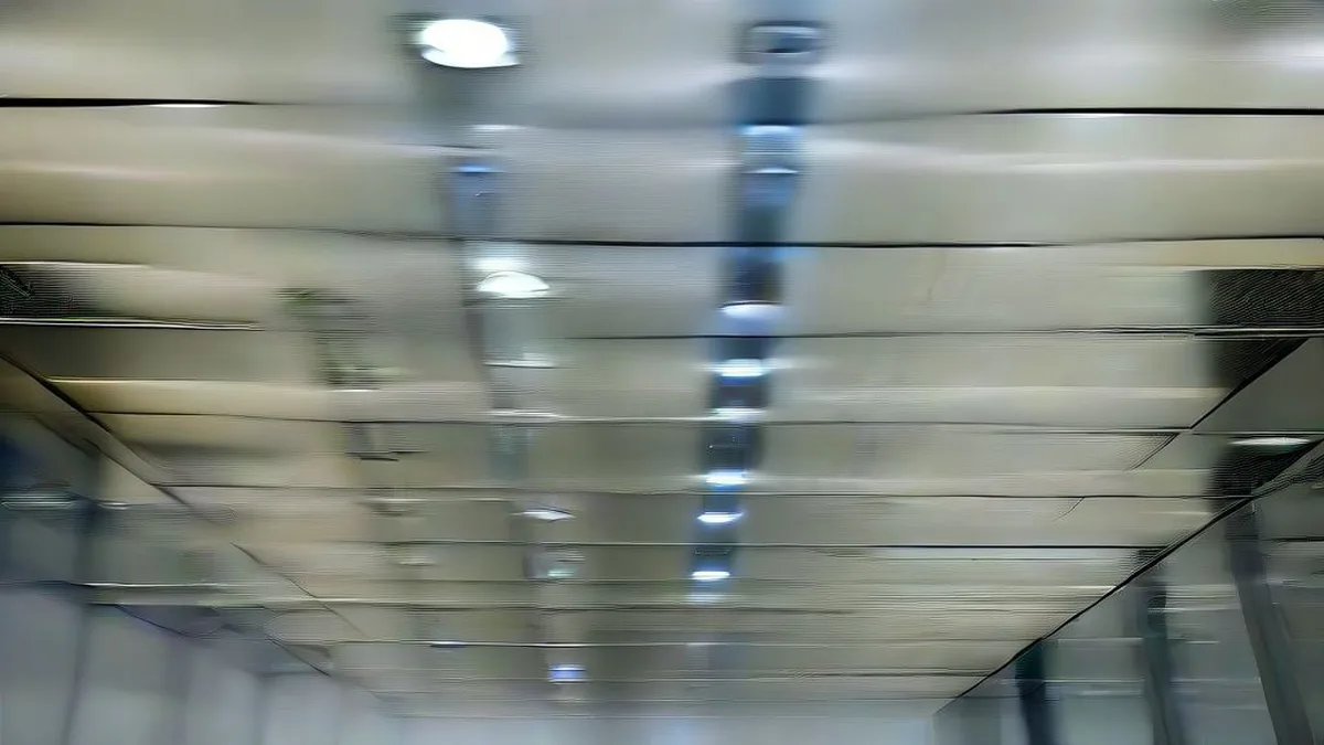 Corridor of high-density enterprise server racks with cooling conduits in a modern data center