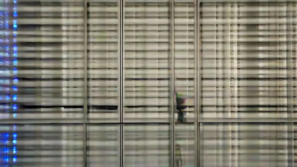 Cybersecurity engineer working amidst server racks in a high-tech data facility