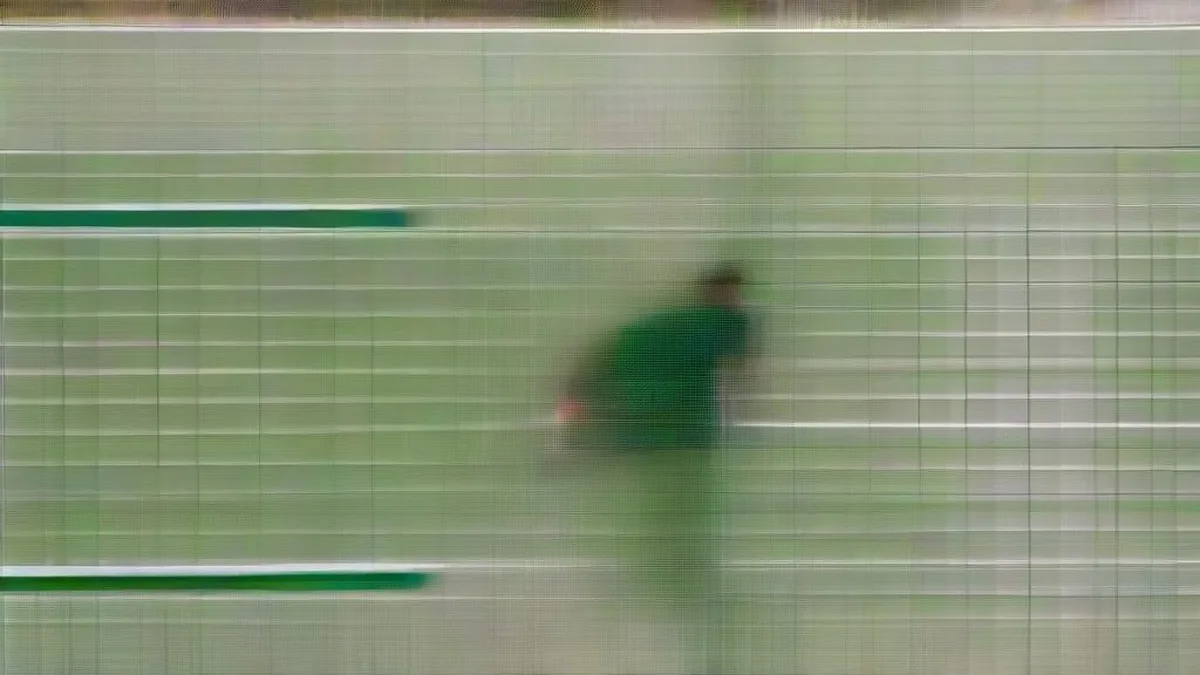 Female badminton player mid-air during an overhead smash at an international tournament