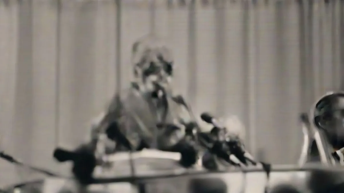 Haryana Chief Minister speaking at a press conference podium with microphones