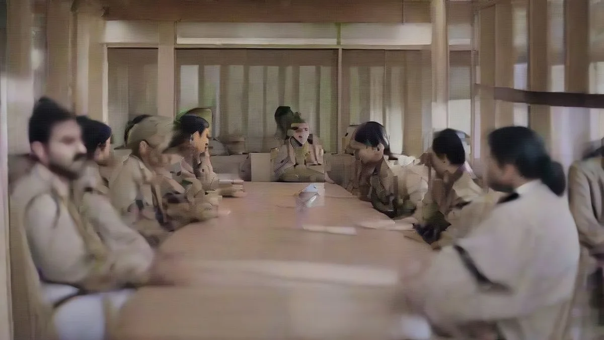 Police officers seated at a formal conference table during an official training session on human rights and ethical conduct.