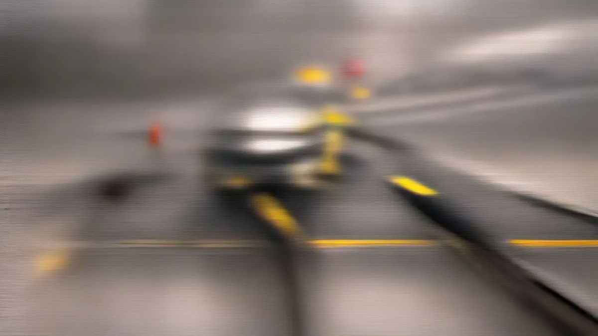 Highway accident scene with damaged vehicle and collapsed utility pole on the road shoulder