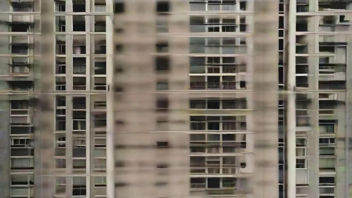 Low-hanging power lines adjacent to multi-story residential building balconies in an urban neighborhood