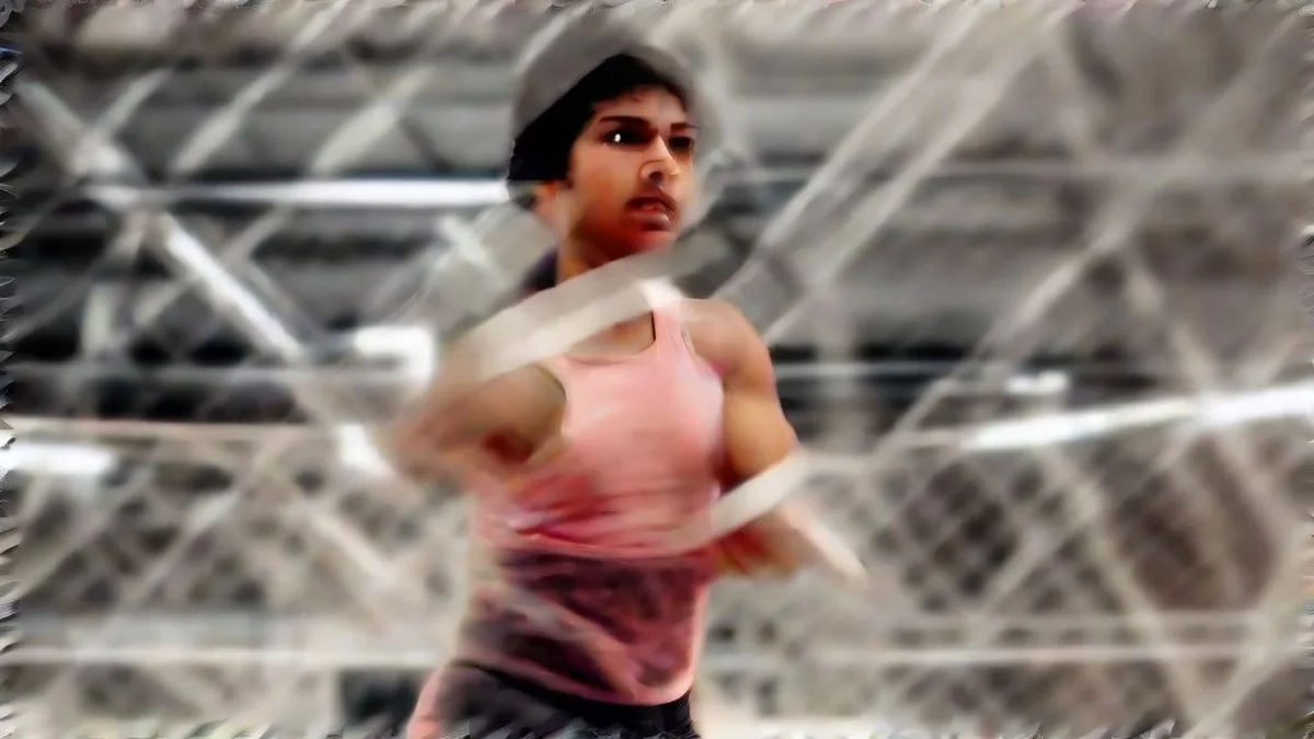 An Indian female boxer with wrapped hands standing inside a training gym