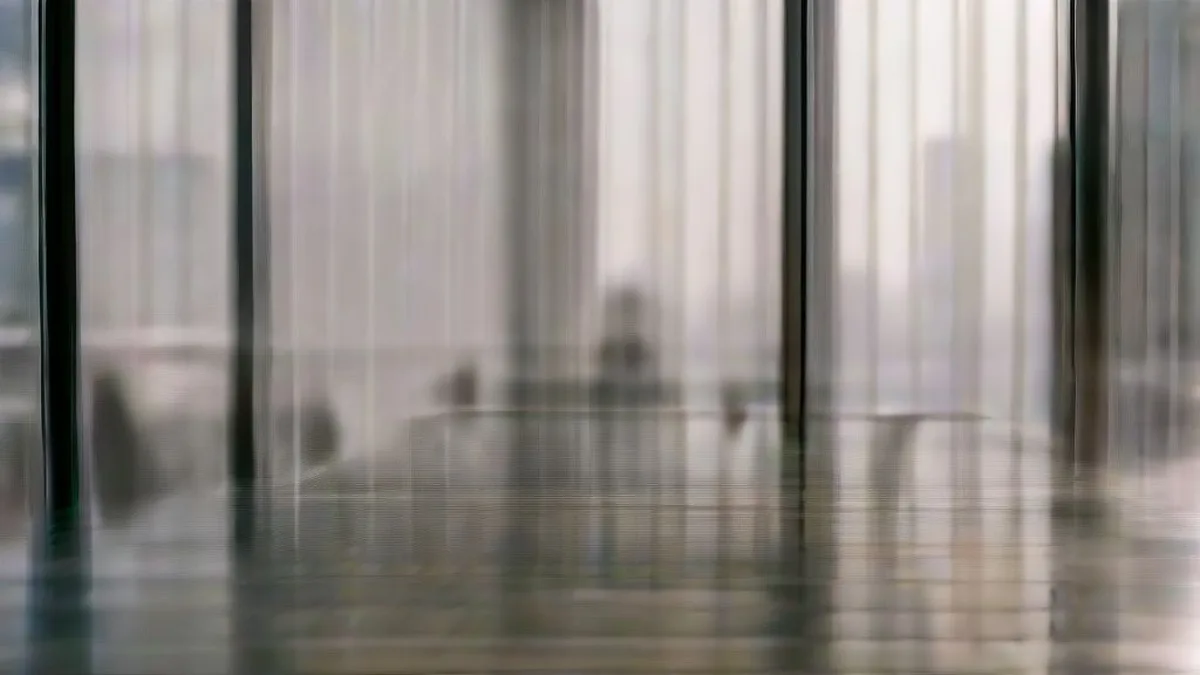 Business professionals seated at a conference table in an executive boardroom