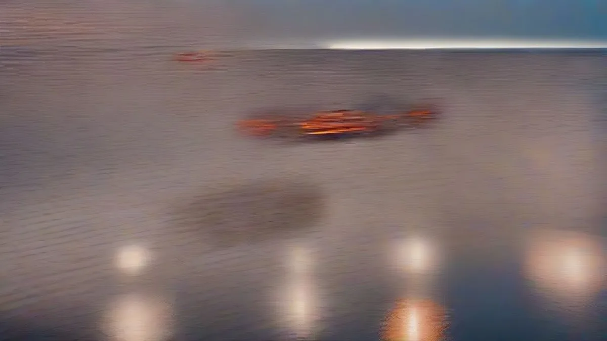 Coastal oil terminal storage tanks and tanker at twilight