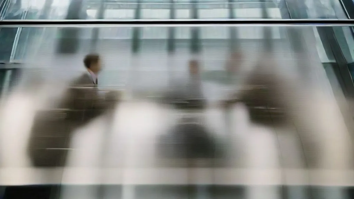 Financial professionals in a modern office discussing market strategy