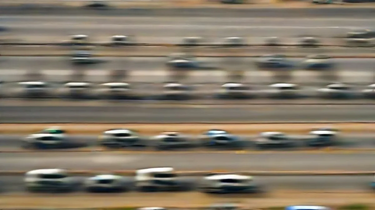 Security convoy of white SUVs moving along a highway in Uttar Pradesh