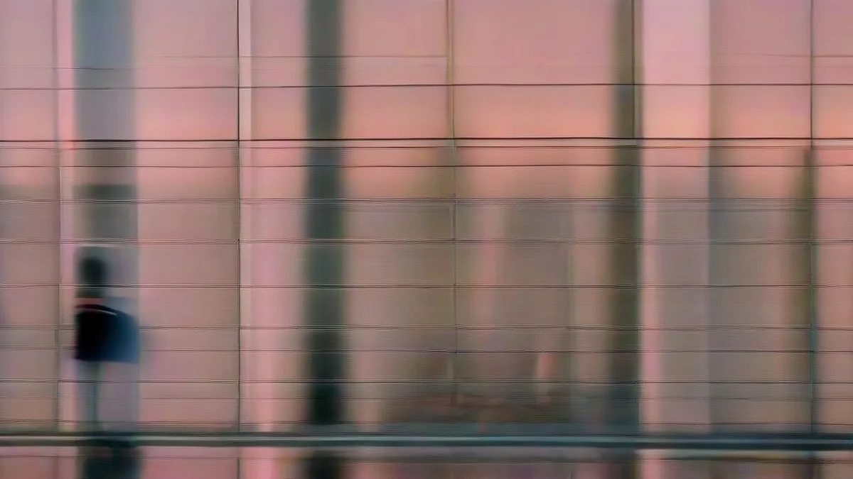 Crowd gathered outside a modern cinema multiplex during evening hours