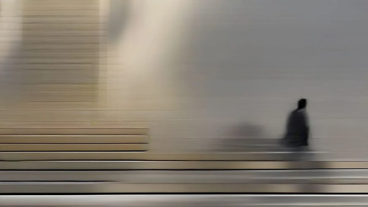 Professionals walking down stone steps outside a central bank building in natural daylight