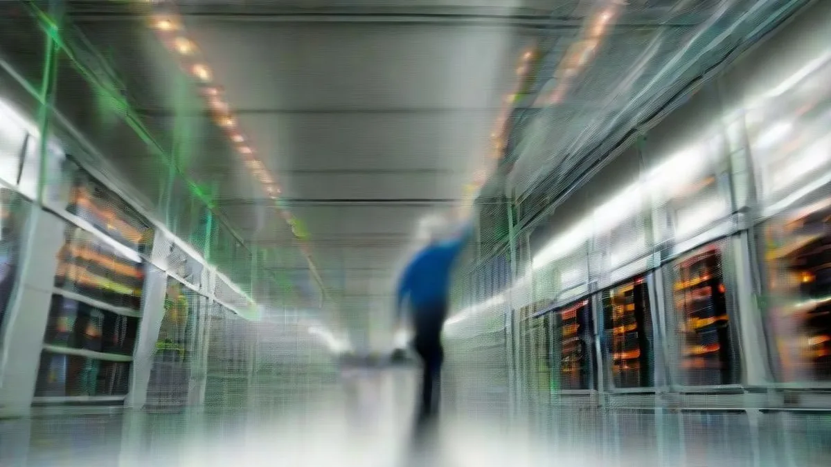 A modern supercomputing data center aisle with high-density server racks and low industrial lighting