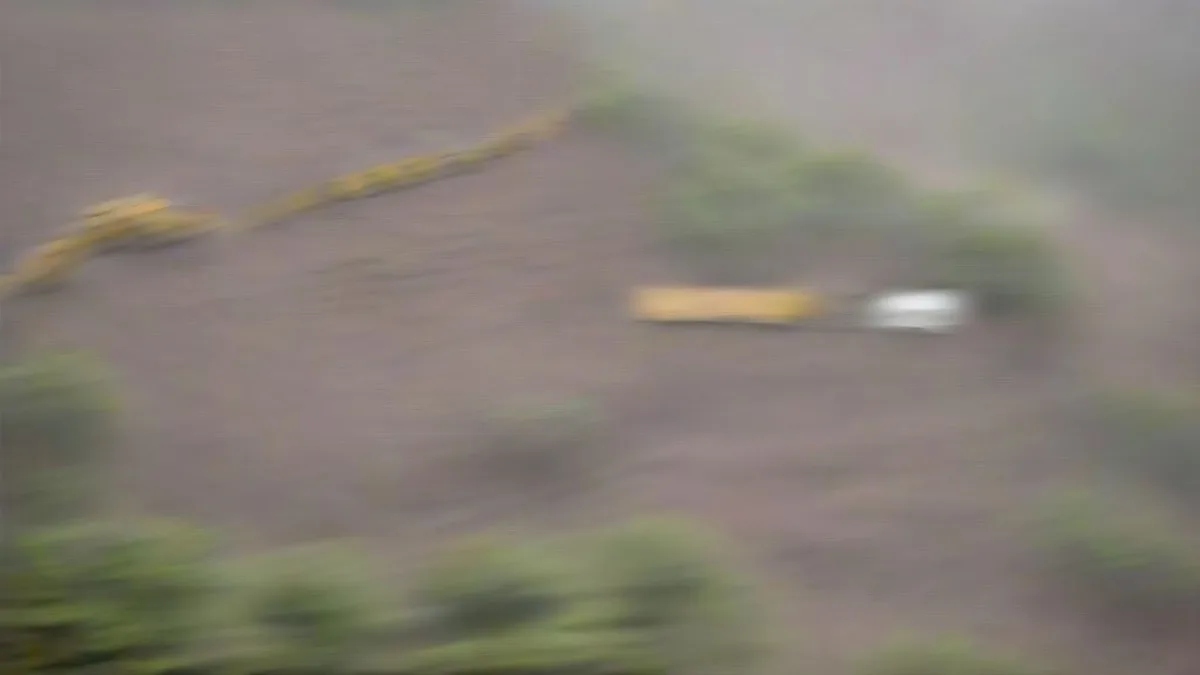 Dense trees and an adjacent infrastructure construction corridor in Maharashtra