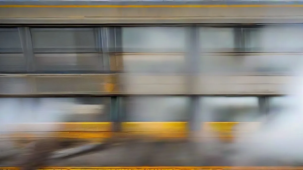 Railway inspection crew in high-visibility vests examining train tracks at dawn