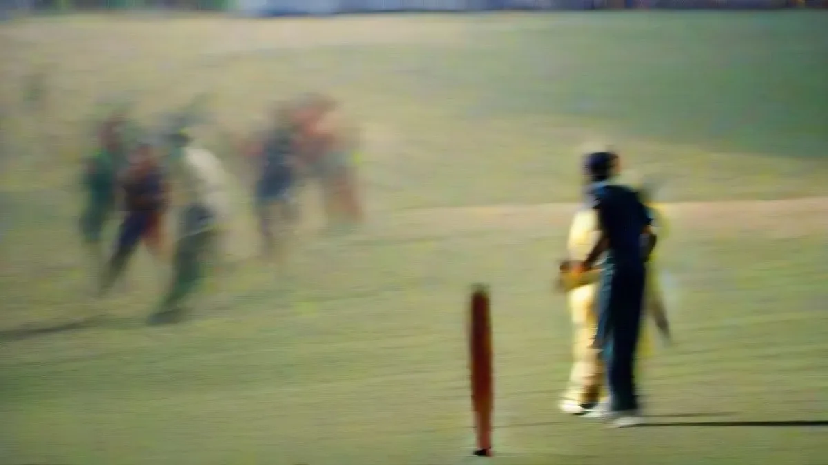 Cricket players celebrating in the middle of a pitch under floodlights after a record-breaking run chase
