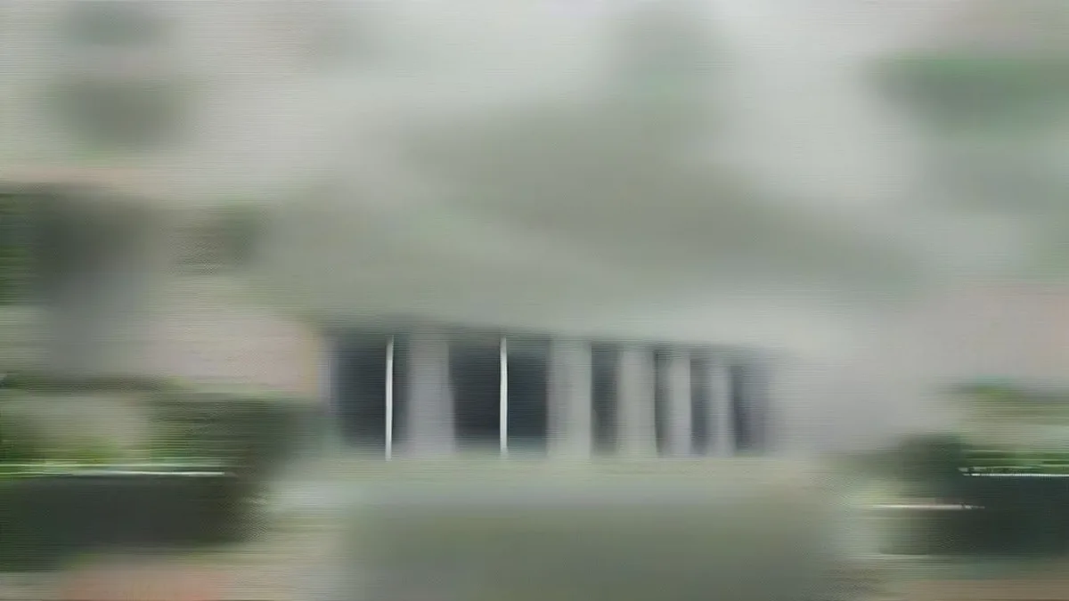 The Supreme Court of India building in New Delhi with lawyers in black robes walking on the premises
