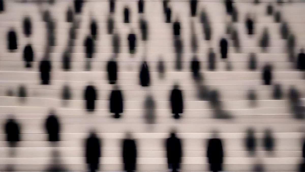 Legal advocates and lawyers descending the steps of a supreme court building with legal files.