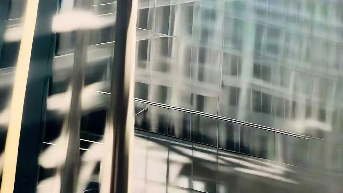 Business professionals walking through a modern glass and steel government office atrium