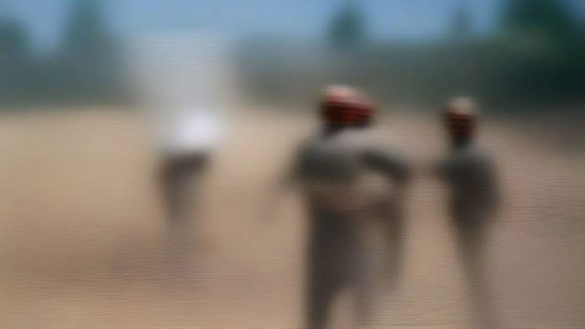 Uniformed police officers stationed along a roadway during a security deployment in rural Punjab