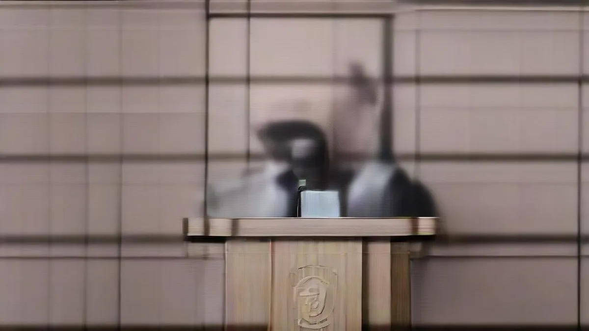 Federal Reserve monetary policy press briefing with official speaking at podium surrounded by microphones