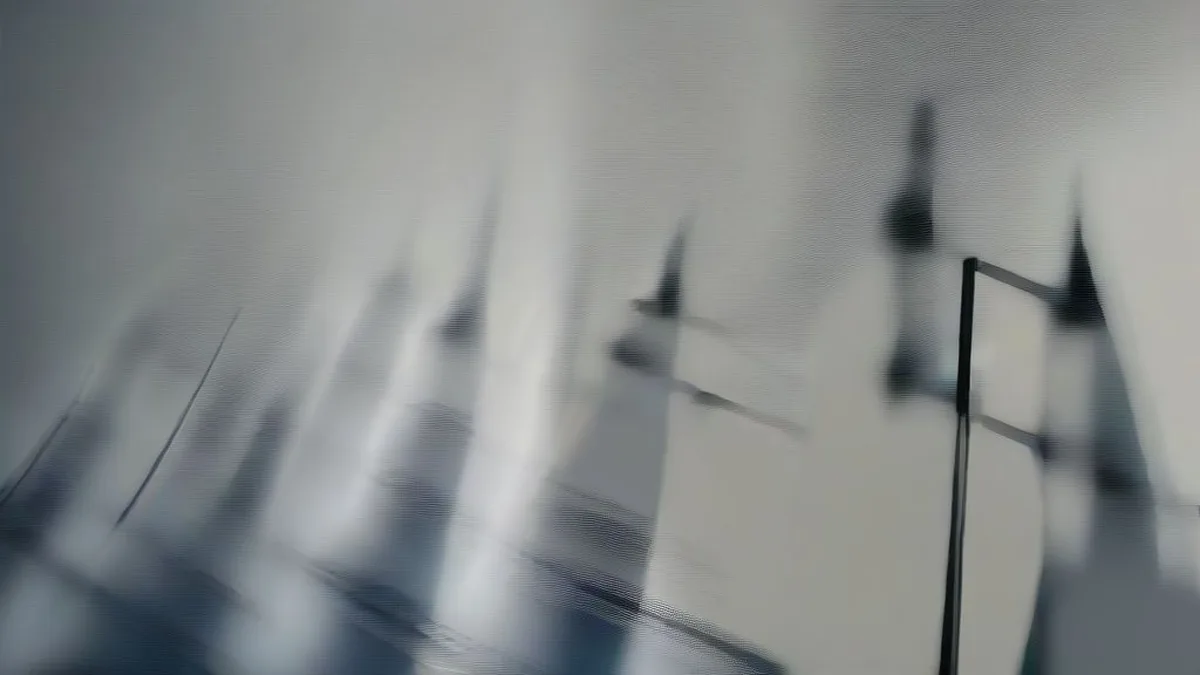 US Navy guided-missile destroyer cruising on open waters at dusk