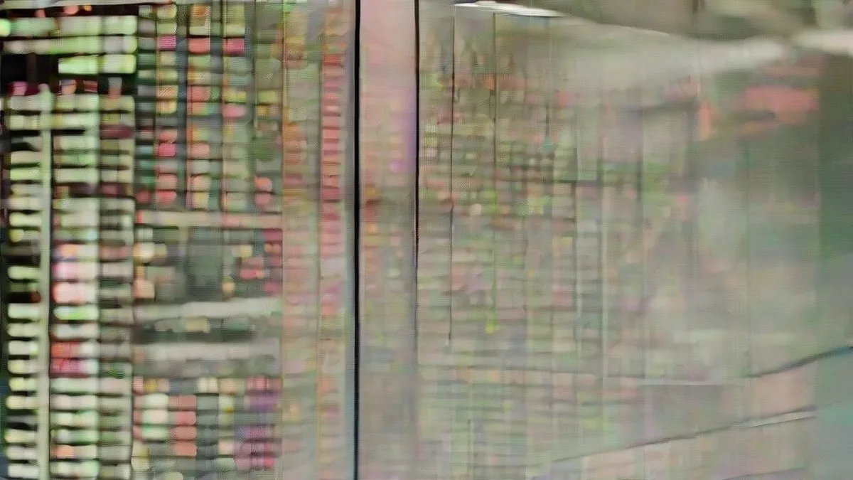Traders at an institutional investment desk monitoring financial markets on multiple screens